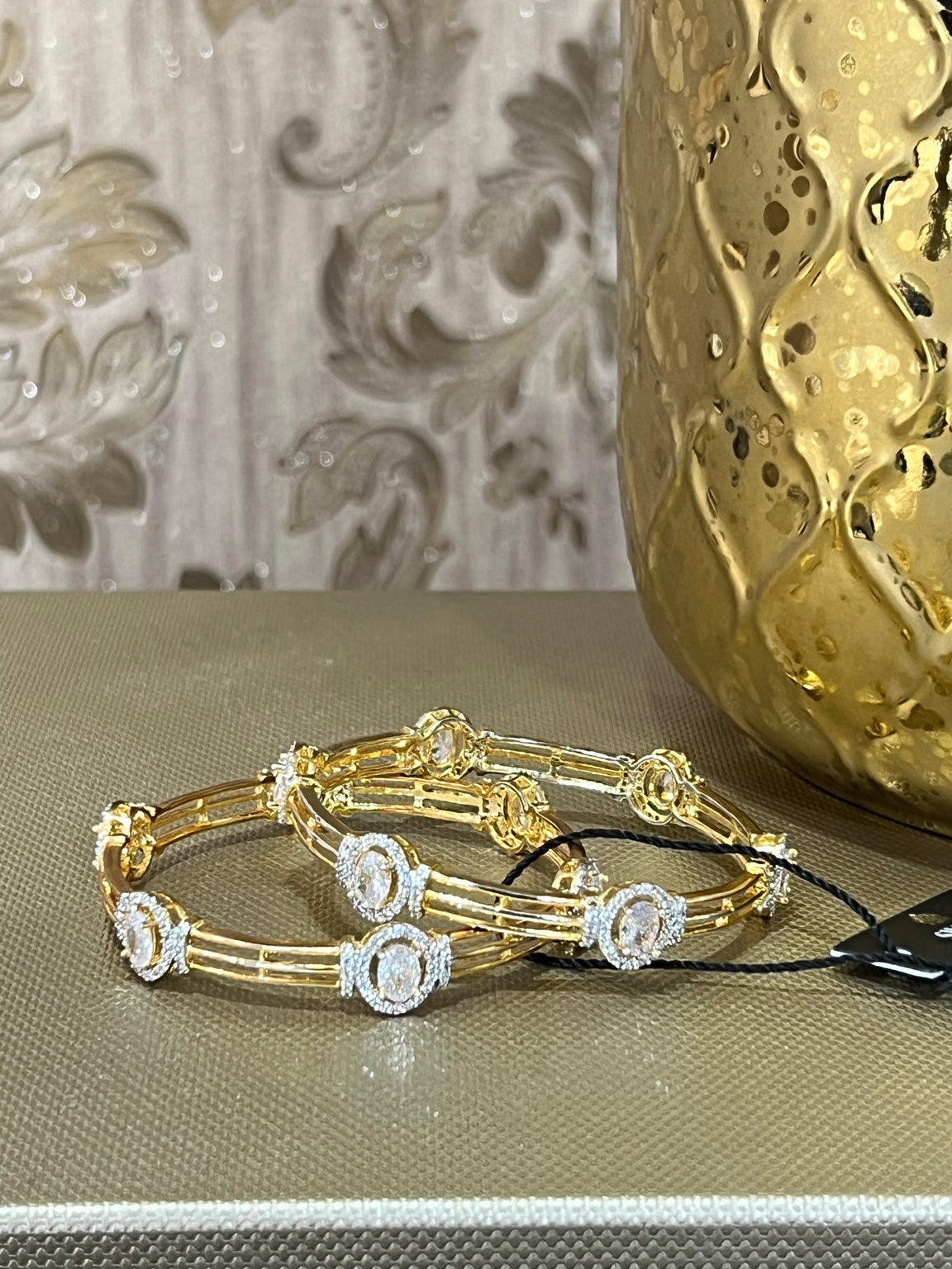 Oval Gold and Clear Bangles
