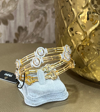 Oval Gold and Clear Bangles